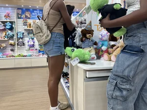 Hot ebony girl in shorts at the store