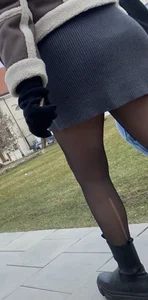 Street creepshots of a girl in a skirt and black pantyhose