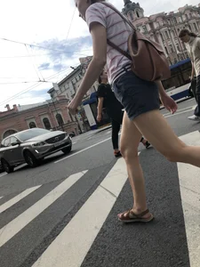 Young Girl in Shorts And Sandals Crossing the Street Gallery