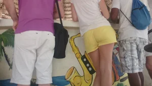 Milf in yellow shorts with vpl and a wedgie