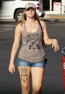 Hot blonde after shopping in short jean shorts and tank top
