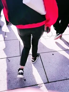 Ass in leather pants closeups on the street