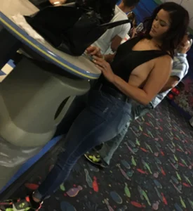 Thick brunette in tight jeans and showing some side boob