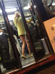 Hot Blonde with Long Skinny Legs Behind the Closing Doors of the Tram