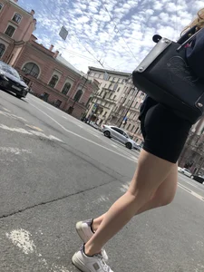 Great legs and booty in spandex shorts of a street candid girl crossing the street