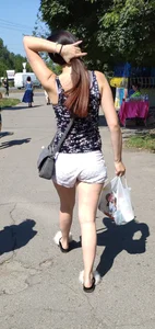 Stocky Girl in Shorts Walking Down the Suburban Street Legs Candid