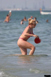 A bunch of sexy beach voyeur babes in bikinis, thongs and topless