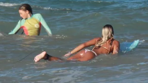 Hot surfer chicks out in the water