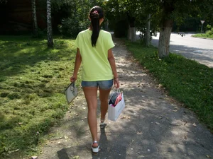 Girl in Denim Mini Shorts Walking Down the Suburb Street Candid