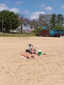 Girl laying out getting sun in a white thong bikini