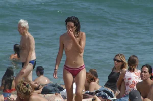Topless girls on a beach in Barcelona