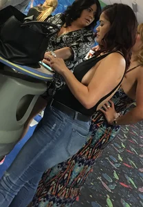 Thick brunette in tight jeans and showing some side boob