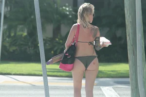 Sexy alt bikini babe with a nice body and tattoos