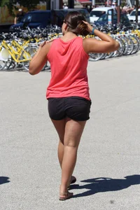 Thick girl in pink top and black shorts with vpl