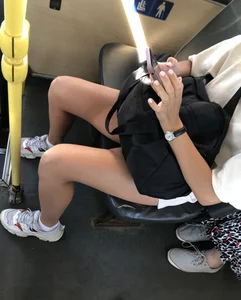 Hot Candid Girl Wearing a Face Mask in Mini Shorts With Great Legs Sitting in a Public Bus Creepshots