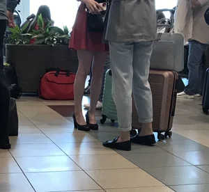 Nice skinny girl with skinny legs wearing a dress and high heels airport creepshot