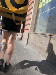 Amazing cute candid food delivery girl with lots of tattoos crossing the street
