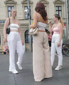 Long blonde braless in a white outfit (many pictures)