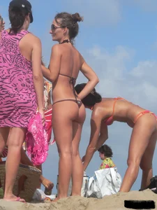Sexy beach lady in tiny brown thong bikini with a nice ass