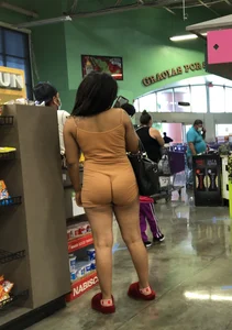Latina with hard nipples and a big booty in tight spandex shorts outfit