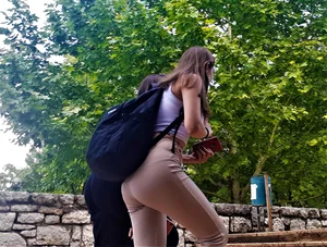 Sexy ass in tight pants on the street stairs creepshots