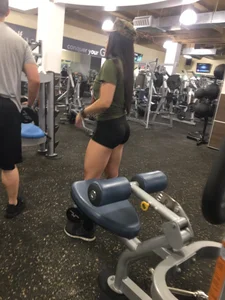 Girl with Muscular Legs in a Gym Hot Candid Photos