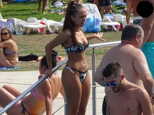 Sexy girl at the pool with a nice ass in thong bikini