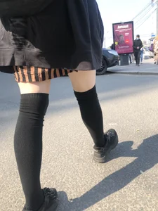 Legs in Knee-Socks And a Skirt - Young Girl Passing By on the Street