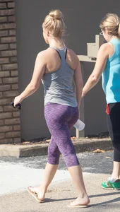 Sexy blonde out walking in purple leggings with a nice ass