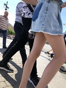 Teen Candid Girl in a Denim Skirt And Sneakers With Thin Legs on a Crosswalk Creepshots