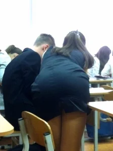 Teen Girl in Short Dress Bending over Desk in College Classroom Candid Pic