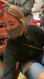 Bends down to show me her face