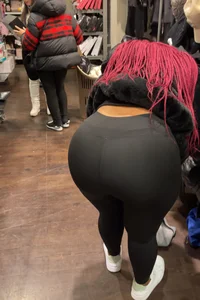 Thick ebony in leggings bent over
