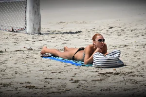 Redhead with nice tits in a bikini on the beach