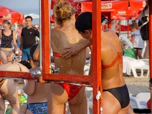 Beach voyeur girls in bikinis, thongs and topless