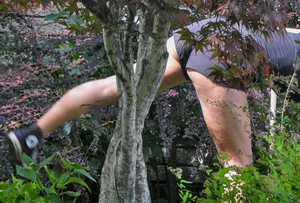 Brunette gardener in shorts bends over… and over as she works [085]