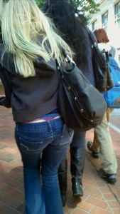 Blonde in tight jeans with her red thong sticking out