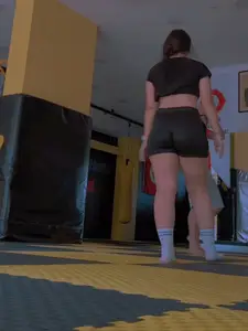 Turkish gym girl wearing a crop top and spandex shorts