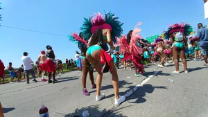 Sexy candid ebony carnival girl dancing in a skimpy costume with a delicious ass