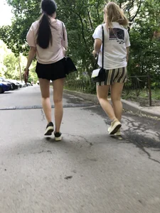 Couple of candid teens walking down the street