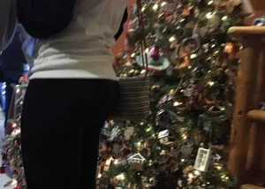 Christmas store girl with a nice booty in leggings with vpl