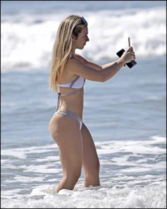 Two hot and sexy girls on the beach in thongs with incredible asses