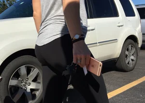 Blonde with a sexy round ass in tight leggings walking