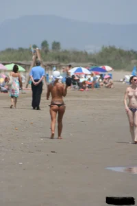 Tattooed blonde with big tits topless and in thong