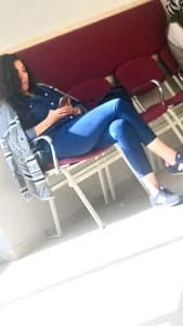 A Sexy Candid Girl in Tight Blue Jeans Sitting With Crossed Legs, Great Legs