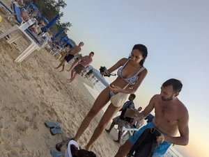 Large collection of hot beach girls lying on the beach and bending over