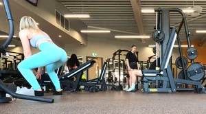 Gym blonde in turquoise leggings notices me and doesn’t mind, even moves in front of me later for some close-ups