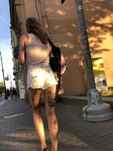 Skinny Girl in Denim Shorts With Fit Tattooed Legs Street Creepshots Gallery