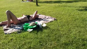 Hot candid girl in underwear lying on the grass in the park video