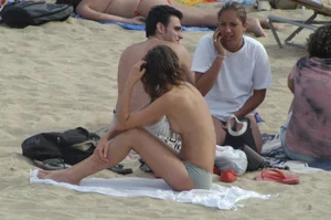 Topless girls on a beach in Barcelona